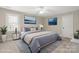 Comfortable bedroom features a queen bed, blue and gray color scheme, and soft lighting at 2840 Wheatfield Ct, Lincolnton, NC 28092