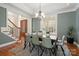 Charming dining room features a tray ceiling, a modern chandelier, and windows with plantation shutters at 2840 Wheatfield Ct, Lincolnton, NC 28092