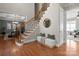 Bright foyer with hardwood floors, staircase with iron spindles, leading to other rooms in the home at 2840 Wheatfield Ct, Lincolnton, NC 28092