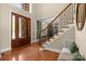Inviting foyer with hardwood floors, staircase with wrought iron railings, and ample natural light at 2840 Wheatfield Ct, Lincolnton, NC 28092