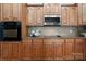 Traditional kitchen features stainless appliances, wood cabinets and granite countertops at 2840 Wheatfield Ct, Lincolnton, NC 28092