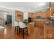 Kitchen with a large island with bar stool seating, stainless appliances and wood cabinets at 2840 Wheatfield Ct, Lincolnton, NC 28092