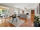 Open floorplan view showcases the fireplace, built-ins, hardwood floors, and casual seating area at 2840 Wheatfield Ct, Lincolnton, NC 28092