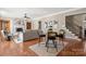 Living space with hardwood floors, a fireplace, and a staircase adjacent to a casual seating area at 2840 Wheatfield Ct, Lincolnton, NC 28092