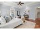 Bright main bedroom with hardwood floors, ceiling fan, and ensuite bathroom access at 2840 Wheatfield Ct, Lincolnton, NC 28092