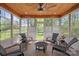 Bright and airy sunroom with a vaulted ceiling, tiled floor, multiple windows, and comfortable seating at 2840 Wheatfield Ct, Lincolnton, NC 28092