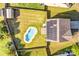 Aerial view of the home with pool, solar panels, fenced yard and a shed at 3010 Berry Creek Rd, Charlotte, NC 28214