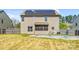 Home's backyard with in-ground pool, fenced yard and screened in porch at 3010 Berry Creek Rd, Charlotte, NC 28214