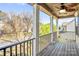 Inviting balcony featuring wood-look floors and a fan for enjoying outdoor comfort and neighborhood views at 3010 Berry Creek Rd, Charlotte, NC 28214