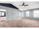 Bright bedroom with neutral carpet, a vaulted ceiling, and natural light at 3010 Berry Creek Rd, Charlotte, NC 28214