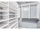 Organized closet with ample shelving and hanging space, maximizing storage potential and decluttering at 3010 Berry Creek Rd, Charlotte, NC 28214