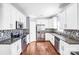 Well-lit kitchen featuring stainless steel appliances and granite countertops at 3010 Berry Creek Rd, Charlotte, NC 28214