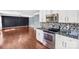 Kitchen with stainless steel appliances featuring views into the living room at 3010 Berry Creek Rd, Charlotte, NC 28214