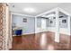Elegant living room showcasing hardwood floors, decorative columns, recessed lighting, and designer details at 3010 Berry Creek Rd, Charlotte, NC 28214