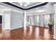 Spacious living area features hardwood floors, recessed lighting, architectural columns, and an open floor plan at 3010 Berry Creek Rd, Charlotte, NC 28214