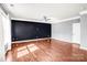 Spacious living room featuring hardwood floors and abundant natural light at 3010 Berry Creek Rd, Charlotte, NC 28214
