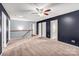 Upstairs loft featuring carpet floors and access to other rooms at 3010 Berry Creek Rd, Charlotte, NC 28214
