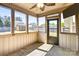 Screened porch with ceiling fan and views of the backyard shed and fence at 3010 Berry Creek Rd, Charlotte, NC 28214