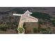 Aerial view of a sprawling property surrounded by lush greenery, showcasing a serene pond at 317 Boyd Rd, Clover, SC 29710