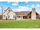 Expansive backyard featuring a large chimney, covered patio, and ample green space at 317 Boyd Rd, Clover, SC 29710