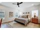 Bright bedroom featuring a ceiling fan, hardwood floors, natural light, and a comfortable bed at 317 Boyd Rd, Clover, SC 29710