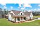 Beautiful new home with brick and siding exterior, covered porch, manicured lawn and landscaping at 317 Boyd Rd, Clover, SC 29710