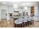Elegant kitchen featuring a large island, modern lighting, and bar seating, perfect for entertaining at 317 Boyd Rd, Clover, SC 29710