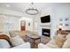 Bright and spacious living room features a modern fireplace and large windows, perfect for gatherings at 317 Boyd Rd, Clover, SC 29710