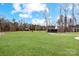Lush green property with scattered trees and a winding driveway leading to the home at 317 Boyd Rd, Clover, SC 29710