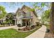 Charming two-story townhome with landscaped yard, blue accents, and a welcoming front porch at 3414 Chagall Ct, Charlotte, NC 28205