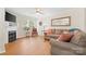 Cozy living room featuring a fireplace, neutral tones, wood floors, and comfortable furnishings for a relaxing atmosphere at 3414 Chagall Ct, Charlotte, NC 28205