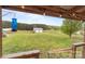 View of the spacious backyard and the detached garage from covered porch at 34958 Lowder Rd, New London, NC 28127