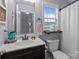 Bathroom with a modern vanity, framed mirror, and neutral walls presents a clean and functional space at 34958 Lowder Rd, New London, NC 28127