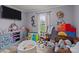 Playful bedroom design includes a cozy brown leather couch, ball pit, and plenty of space at 34958 Lowder Rd, New London, NC 28127