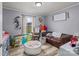 Playful bedroom design includes a cozy brown leather couch, ball pit, and plenty of space at 34958 Lowder Rd, New London, NC 28127