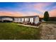 Charming single-story home with a metal roof, well-maintained lawn, and inviting front porch at 34958 Lowder Rd, New London, NC 28127