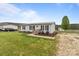 Charming single-story home with a metal roof, well-maintained lawn, and inviting front porch at 34958 Lowder Rd, New London, NC 28127