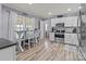 Bright kitchen with modern appliances, white cabinetry, and a breakfast bar at 34958 Lowder Rd, New London, NC 28127