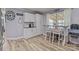 Charming kitchen with a breakfast nook, white cabinets, and modern flooring at 34958 Lowder Rd, New London, NC 28127