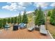 Inviting back deck with comfortable seating, lounge chairs, and a serene view of the landscaped backyard at 4004 Henshaw Rd # 448, Waxhaw, NC 28173