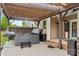 Outdoor living space with a hot tub and pergola-covered seating area, perfect for relaxation and entertainment at 4004 Henshaw Rd # 448, Waxhaw, NC 28173