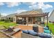 Spacious backyard featuring a deck with lounge furniture, a hot tub, and an outdoor kitchen under a pergola at 4004 Henshaw Rd # 448, Waxhaw, NC 28173