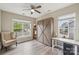 Bright room with a neutral palette, built-in Murphy bed, and a ceiling fan at 4004 Henshaw Rd # 448, Waxhaw, NC 28173