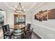 Elegant dining room with unique table design, stylish lighting, and sophisticated decor at 4004 Henshaw Rd # 448, Waxhaw, NC 28173