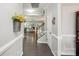 Bright entryway showcasing hardwood floors and staircase leading to a welcoming living space at 4004 Henshaw Rd # 448, Waxhaw, NC 28173