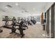 Well-equipped gym with modern cardio machines, neutral walls, and ample lighting for a comfortable workout experience at 4004 Henshaw Rd # 448, Waxhaw, NC 28173