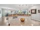 Open-concept kitchen with granite countertops, stainless appliances, and view of living area at 4004 Henshaw Rd # 448, Waxhaw, NC 28173