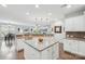 Open kitchen featuring a large island with seating, granite countertops, and seamless flow into living spaces at 4004 Henshaw Rd # 448, Waxhaw, NC 28173