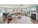 Spacious living room featuring modern furniture, fireplace, and large windows for abundant light at 4004 Henshaw Rd # 448, Waxhaw, NC 28173