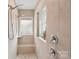 Tiled shower with dual shower heads and a built-in bench at 4004 Henshaw Rd # 448, Waxhaw, NC 28173